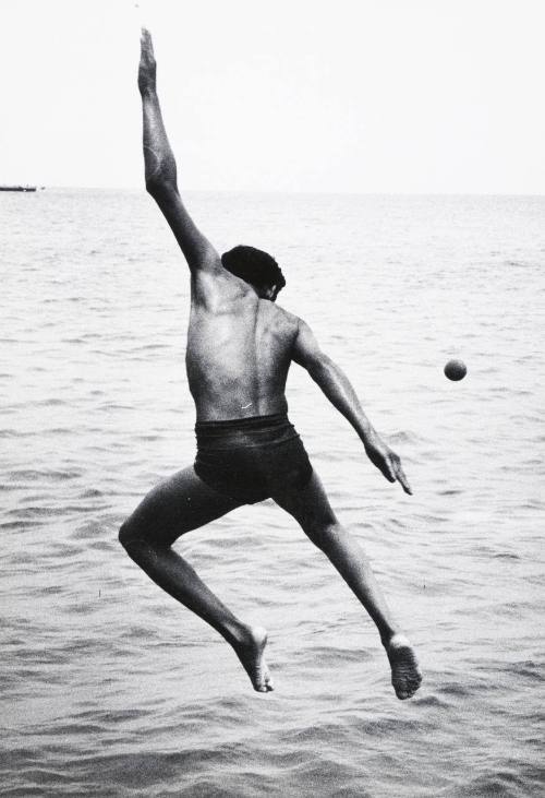 Untitled (throwing ball into water)
