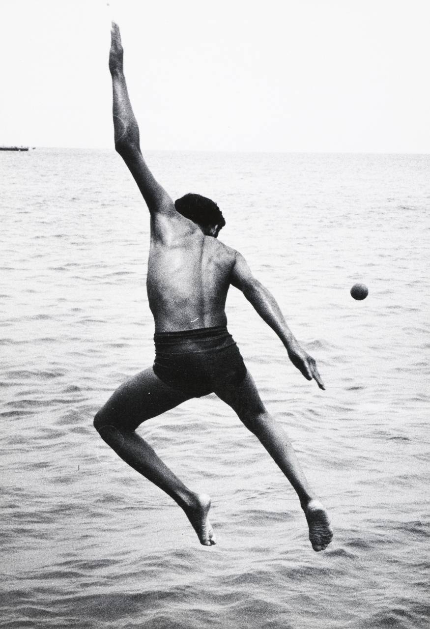 Untitled (throwing ball into water)