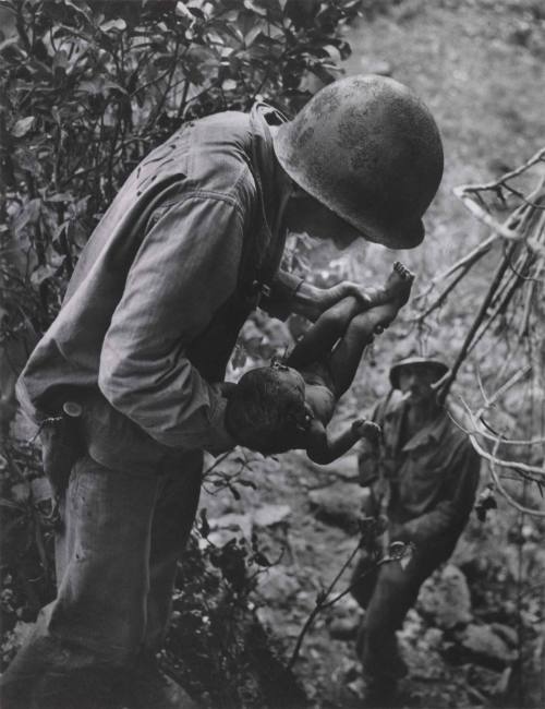 Wounded, Dying Infant Found by American Soldier in Saipan Mountains