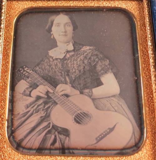 Woman holding a guitar