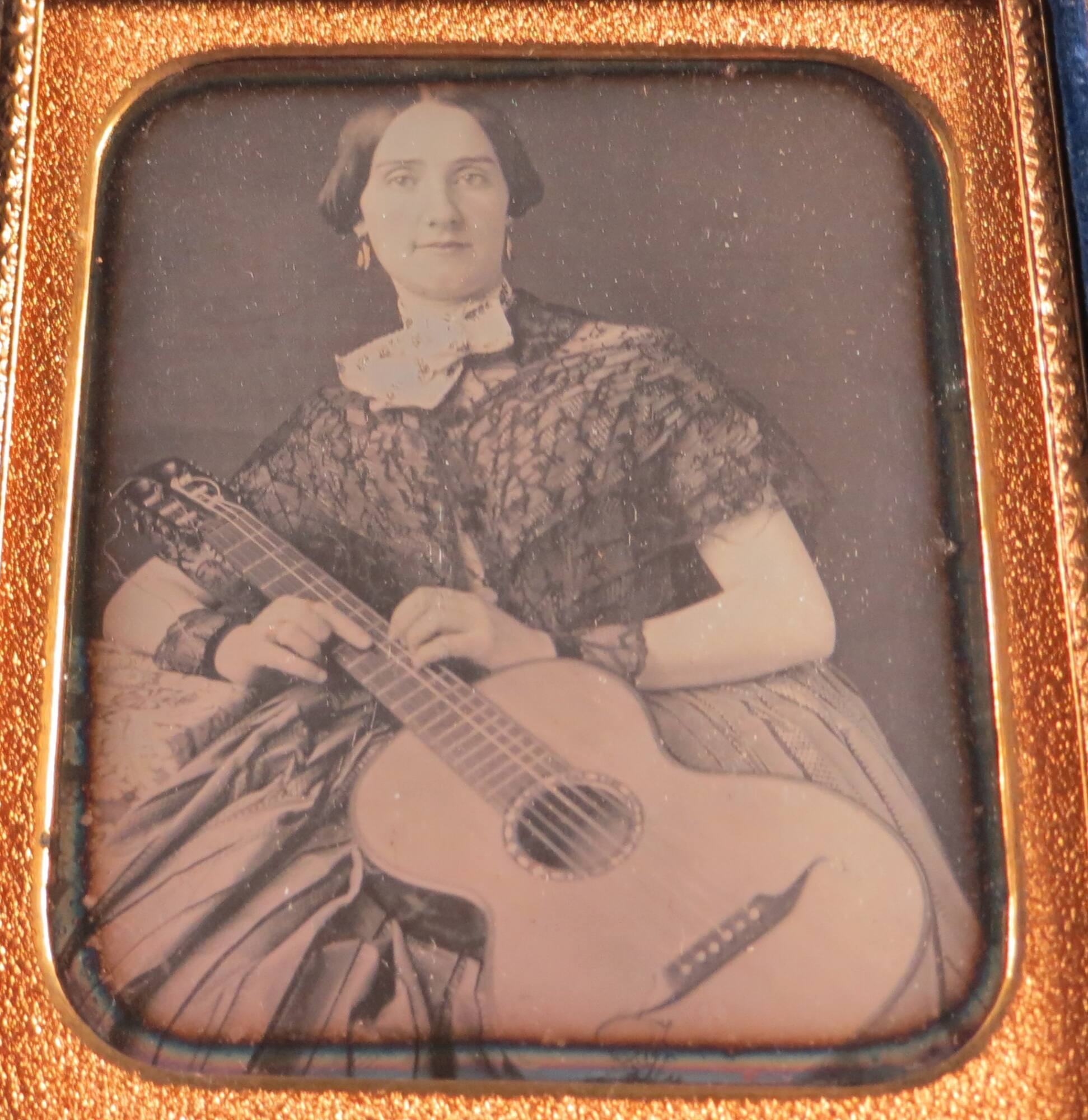 Woman holding a guitar