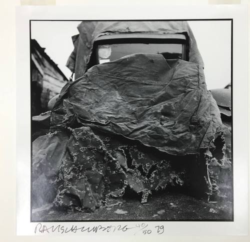 Car with tarpaulin