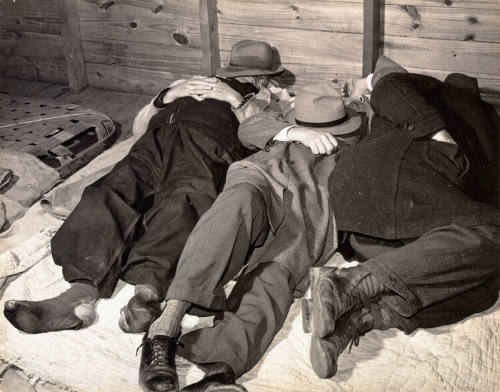 Tobacco workers taking a nap in tobacco warehouse, Durham, North Carolina