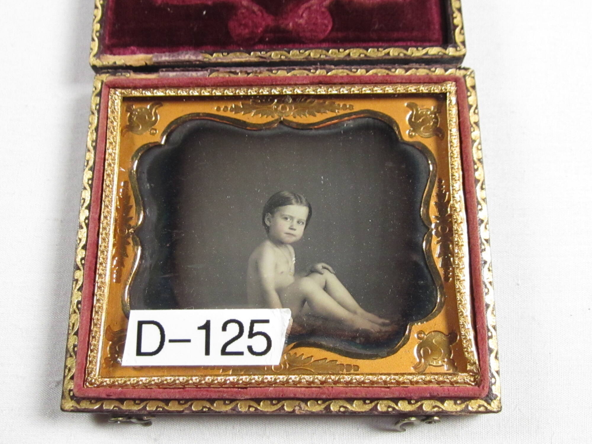 Nude child on table