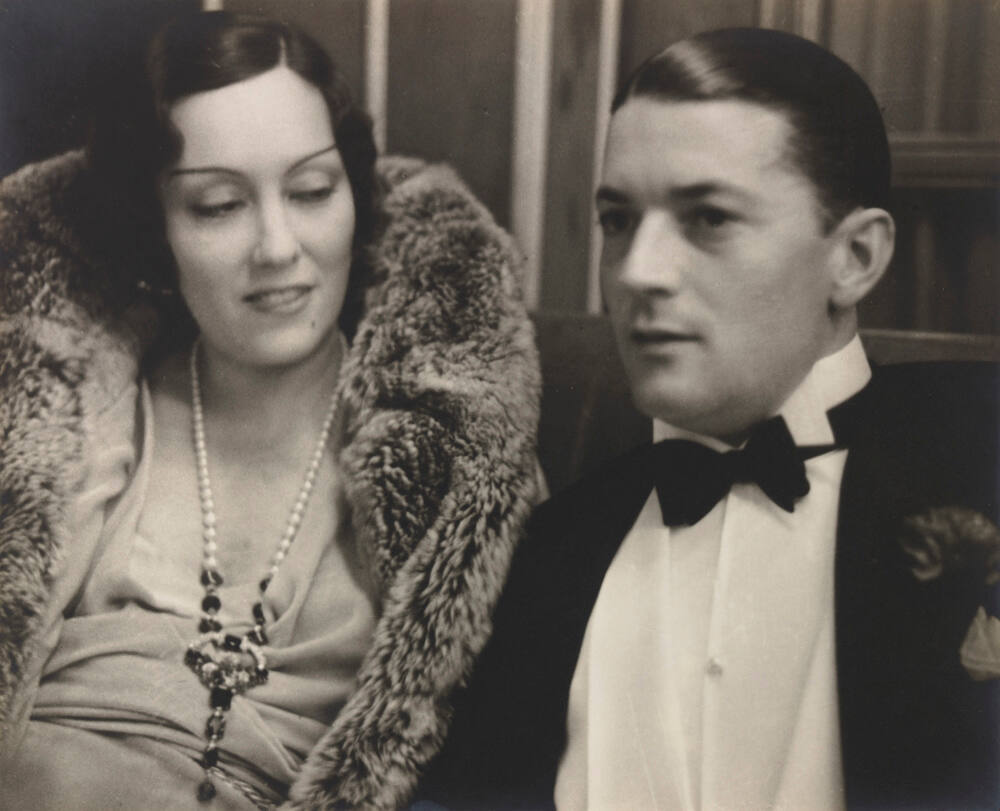 Gloria Swanson and husband Michael Farmer in the bar of the Palace Hotel in St. Moritz