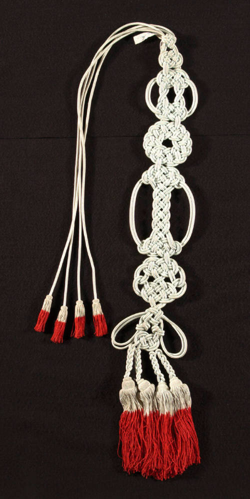 Buddhist monk's tassels with red stripe at bottom