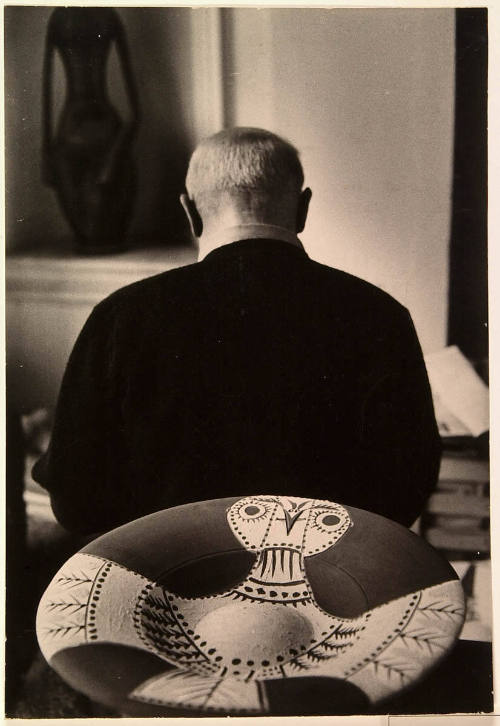 Picasso Starts to Paint Plates; Bronze Head of Dora Maar Above. Colors on Plates After Firing, and Examines Other Newly-painted Plates Before Firing